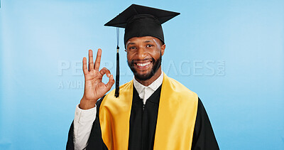 Buy stock photo Portrait, black man and ok sign for graduation in studio with celebration, education success and thank you. Smile, student and hand gesture with ceremony feedback, university vote and blue background