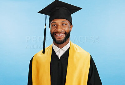 Buy stock photo Portrait, university and black man with smile, graduation and education on blue studio background. African person, model and student with success, achievement and scholarship with happiness and award