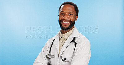Buy stock photo Portrait, doctor and black man with arms crossed in studio, healthcare and employee on blue background. African person, face and medical with professional, pride and confidence with gp and lab coat