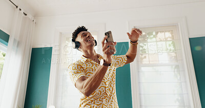 Buy stock photo Man, winner and dance with phone for good news, college acceptance and celebration in home. Achievement, victory and opportunity with student in living room for university scholarship and energy