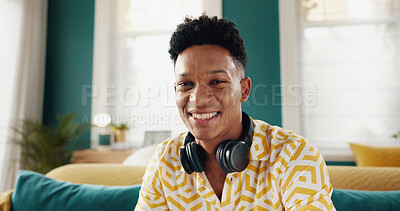 Buy stock photo Portrait, relax and man with headphones, home and smile for break in living room, couch and apartment. House, calm and happy for weekend on sofa, positive mindset and person in lounge and Canada