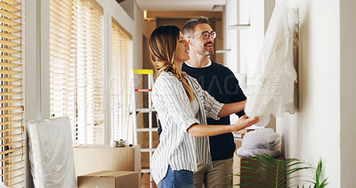 Buy stock photo Moving in, boxes and couple with unpacking, painting and bonding together in new house. Man, woman and smile with decor, love and pride for real estate and dream home celebration for future mortgage