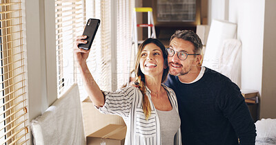 Buy stock photo Moving in, boxes and couple with smile, selfie and bonding together in new house. Man, woman and phone for profile pictures, memories and real estate for dream home celebration or future mortgage