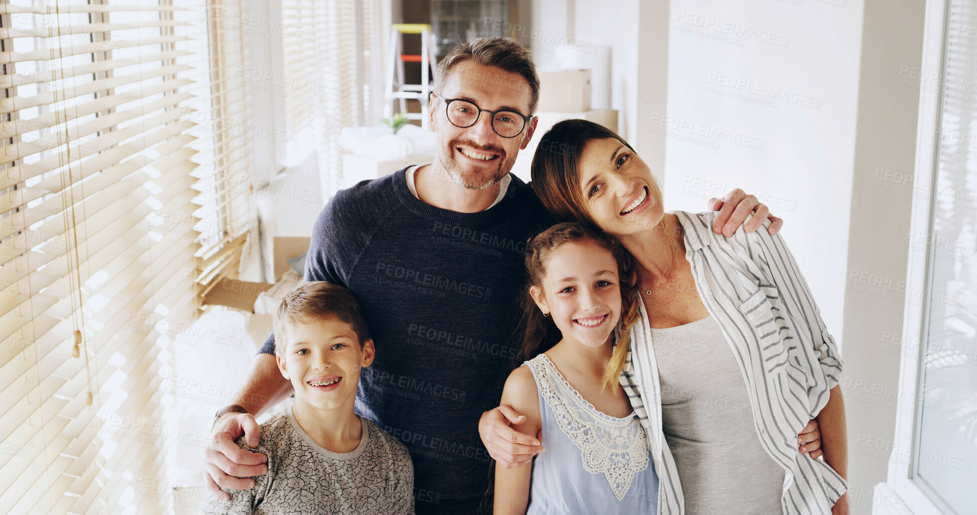 Buy stock photo Parents, children and smile with hug in home, portrait and care with connection, love and bonding. Mother, father and kids with embrace, people and happy in family house with support in Portugal