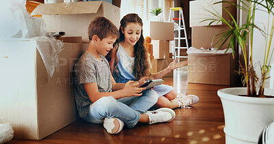 Buy stock photo Siblings, tablet and children in new home with boxes, care and video games for online challenge. Happy kids, boy and girl with touchscreen technology for streaming fun movies on floor in family house