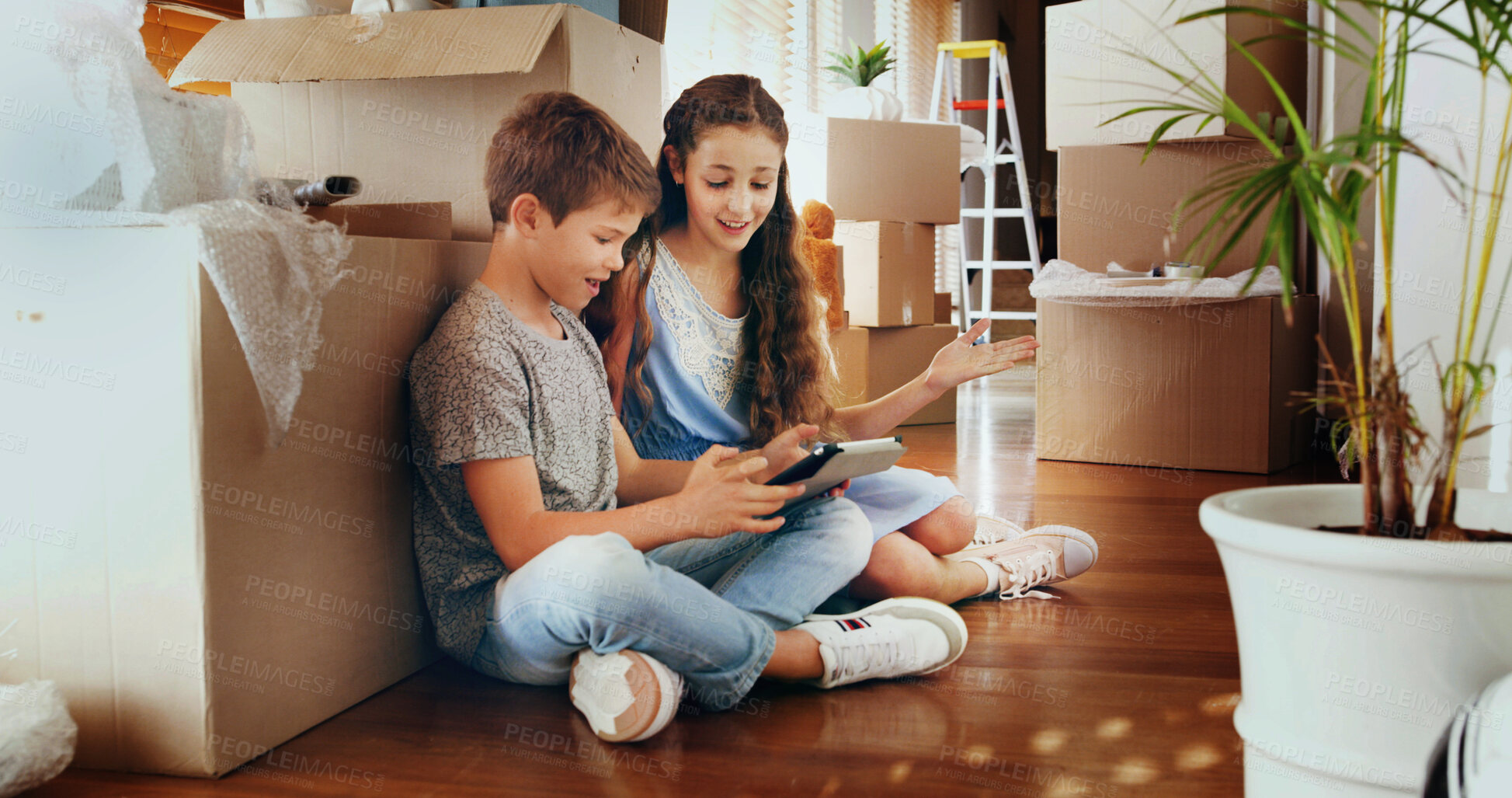 Buy stock photo Siblings, tablet and children in new home with boxes, care and video games for online challenge. Happy kids, boy and girl with touchscreen technology for streaming fun movies on floor in family house