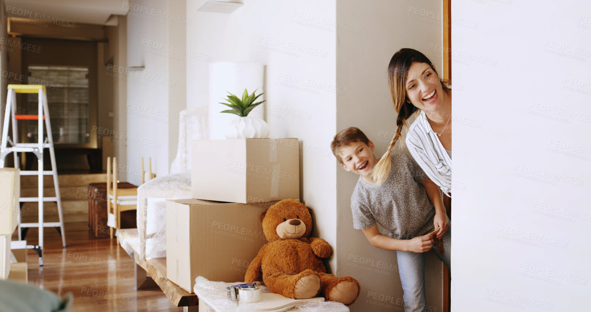 Buy stock photo Games, mom and child in new house, hiding and happy for investment of real estate, purchase or playing. Moving, laughing and bonding with fun in home, boxes and woman with son in property or mortgage