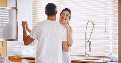 Buy stock photo Couple, happy and dancing in kitchen, morning or memory with bonding, care and love in home. Mature man, woman and people with moving together, smile and holding hands with partner at apartment