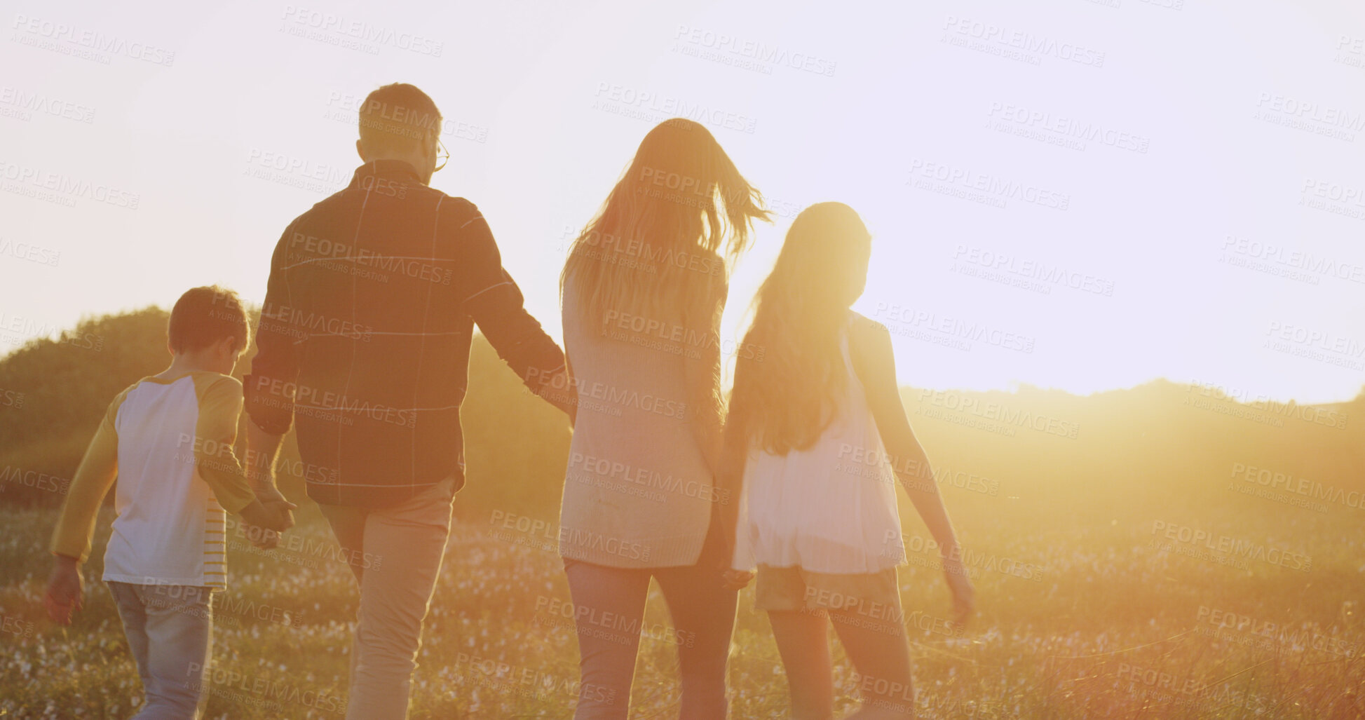 Buy stock photo Back, holding hands or family in park walking in farm for bonding, adventure and travel on field. Sunshine, outdoor and mom with boy, girl and father with love, siblings and parents in countryside