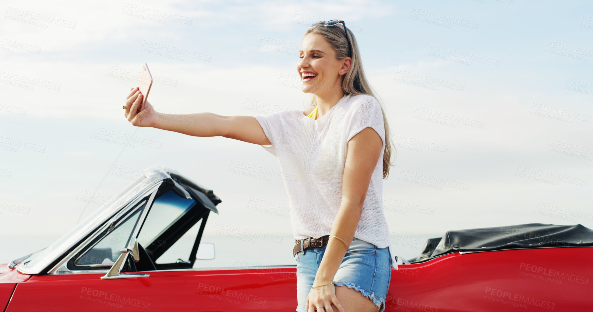 Buy stock photo Road trip, excited woman and selfie with car for travel, vacation or holiday outdoor by sea. Convertible transport, girl and picture on journey for memory, social media post and influencer vlogging
