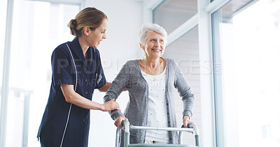 Buy stock photo Physical therapy, smile and senior woman with walker, support or balance for rehabilitation in clinic. Healthcare, physiotherapist and help for elderly person with disability, kindness and talking
