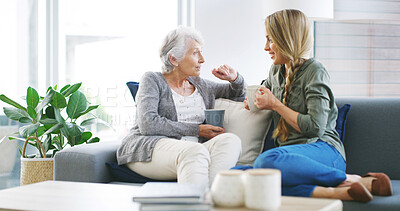 Buy stock photo Elderly mother, woman and relax with coffee for conversation, gossip story and weekend visit in home. Senior person, daughter or tea time in living room sofa for bonding, love or healthy relationship