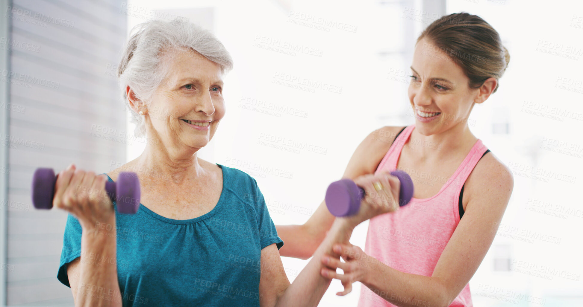 Buy stock photo Elderly woman, physiotherapist and dumbbells in gym for fitness, instruction or arm injury recovery. Senior client, physiotherapy or weights in practice with support, muscle development or joint care