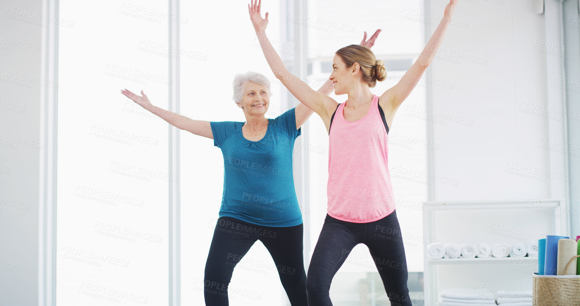 Buy stock photo Yoga, senior woman and trainer for fitness, healthy body and smile for geriatric wellness. Stretching, pilates coach and exercise together for balance, holistic and help with physical therapy in gym