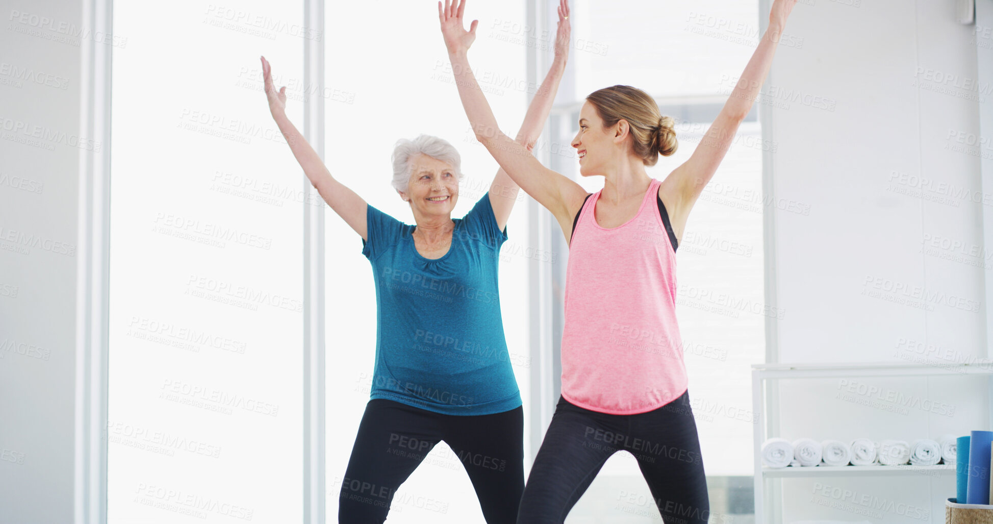 Buy stock photo Yoga, woman and stretching with coach for fitness, healthy body and smile for geriatric wellness. Senior, pilates trainer and exercise together for balance, holistic or help with physiotherapy in gym