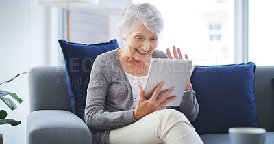 Buy stock photo Video call, greeting and senior woman with tablet on sofa in living room for telehealth communication. Happy, waving and elderly person on virtual medical consultation on digital technology in home.