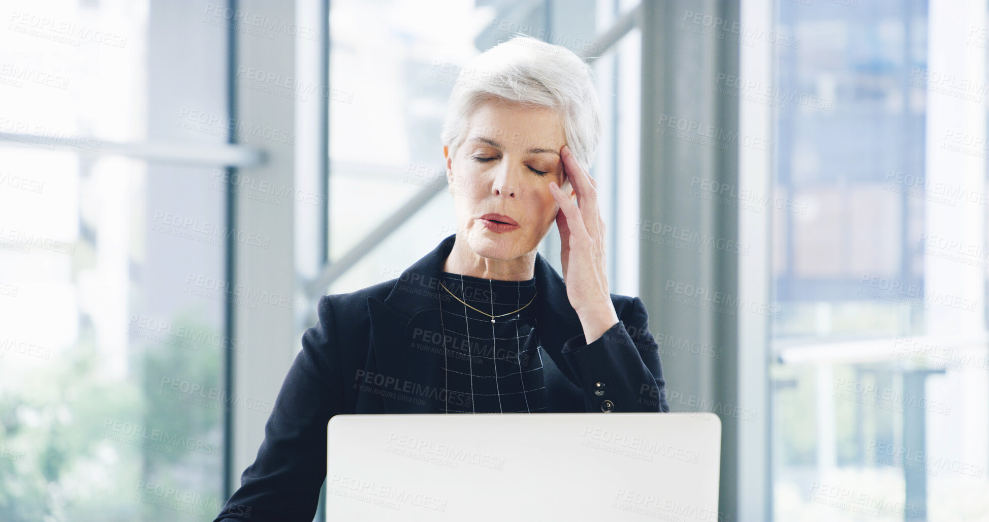 Buy stock photo Headache, laptop and stress with business woman in office for debt solution, loan application and anxiety. Bank manager, client portfolio and tired with mature person in finance firm for burnout