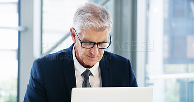 Buy stock photo Laptop, thinking and mature businessman in office for legal case, proposal and project or online research. Corporate attorney, lawyer and worker on computer for report, typing email and planning