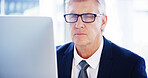 Computer, portrait and mature businessman in office for legal case, proposal and project or online research. Corporate attorney, lawyer and worker for consultant report, typing email and planning