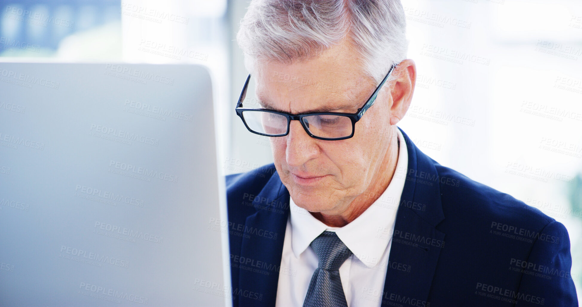 Buy stock photo Computer, thinking and mature businessman in office for legal case, proposal and project or online research. Corporate attorney, lawyer and worker for consultant report, typing email and planning