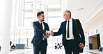 Business, people and handshake in lobby for welcome, greeting or CEO respect. Corporate men, smile or shaking hands in office building for introduction, intern onboarding or job shadowing opportunity