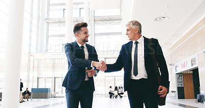 Buy stock photo Business, people and handshake in lobby for welcome, greeting or CEO respect. Corporate men, smile or shaking hands in office building for introduction, intern onboarding or job shadowing opportunity