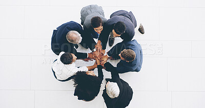 Buy stock photo Business people, meeting and hands together with teamwork above for motivation or collaboration at office. Top view, group or employees piling in unity or solidarity for trust, support or mission
