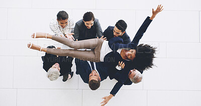 Buy stock photo Celebration, lifting and throwing with business people in lobby of office from above for success. Bonus, promotion or winner group and woman employee in air with corporate team for congratulations
