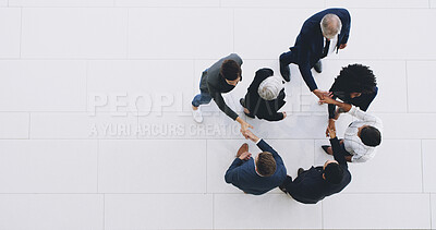 Buy stock photo Business people, meeting and handshake with space above for greeting, collaboration or introduction at office. Top view, group or employees shaking hands for trust, teamwork or gathering at workplace