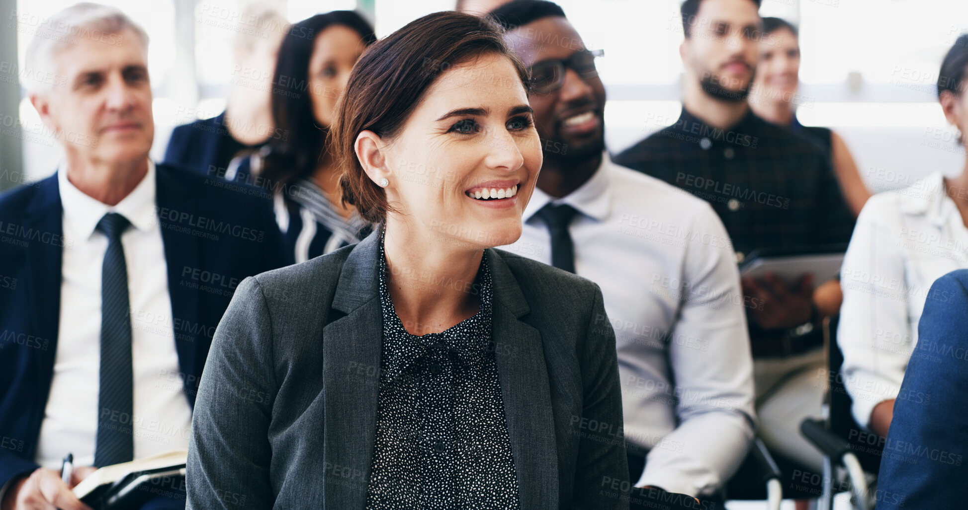 Buy stock photo Woman, listening and smile in crowd, convention and attention for announcement with group. Business people, person and audience with diversity, success and happy for conference at insurance agency