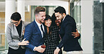 Success, hug and excited business people in office with achievement, collaboration and solidarity. Happy teamwork, men and women embrace with celebration, cheers and support at development startup