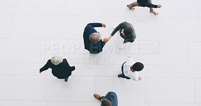 Buy stock photo Business people, top view and handshake for merger in office, negotiation success and acquisition. Men, partnership and thank you for help with investment funding in workplace, agreement and welcome
