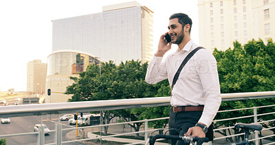 Buy stock photo Bike, bridge and phone call with business man outdoor for carbon neutral travel to work. City, commute and conversation with happy employee person walking in urban town for communication or update