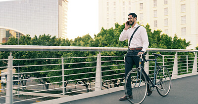 Buy stock photo Bike, bridge and phone call with employee man outdoor for communication or travel to work. Carbon neutral, city and conversation with happy business person in urban town for commute or update