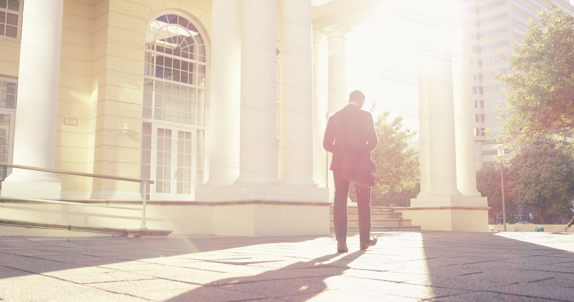 Buy stock photo Back, business and man walking in city of real estate travel, showcase viewings and morning commute. Professional, male consultant and urban explore for commercial property, infrastructure conditions