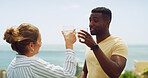 Relax, ocean and couple cheers on hotel terrace for tropical vacation with drinks, travel and bonding together. Cocktail, man and woman at beach resort with toast, smile and love on island holiday