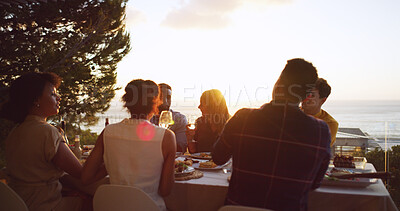 Buy stock photo Dinner party, food and sunset with friends on balcony of restaurant together for reunion. Accommodation, eating or hospitality with man and woman group at table for bonding, celebration or meal