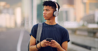 Buy stock photo Music, phone and thinking with man on bridge in city to search map app for directions to location. Headphones, idea and walking with African person outdoor in urban town for commute or travel