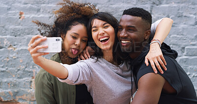 Buy stock photo Selfie, goofy and group of friends by wall in city for memory, social media or profile picture on holiday. Happy, funny and young people with photography for reunion content creation vlog in town.