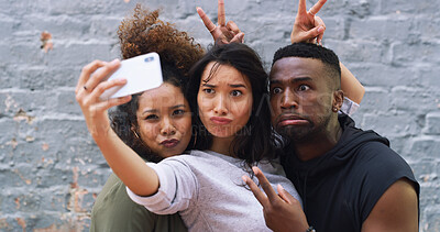 Buy stock photo Selfie, comic and group of friends by wall in city for memory, social media or profile picture on holiday. Funny, goofy and young people with photography for reunion content creation vlog in town.
