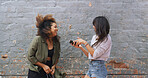 Wall, women and friends with smartphone, laughing and celebration for acceptance to college or online. Excited, success and student with email for application, notification and registration to school
