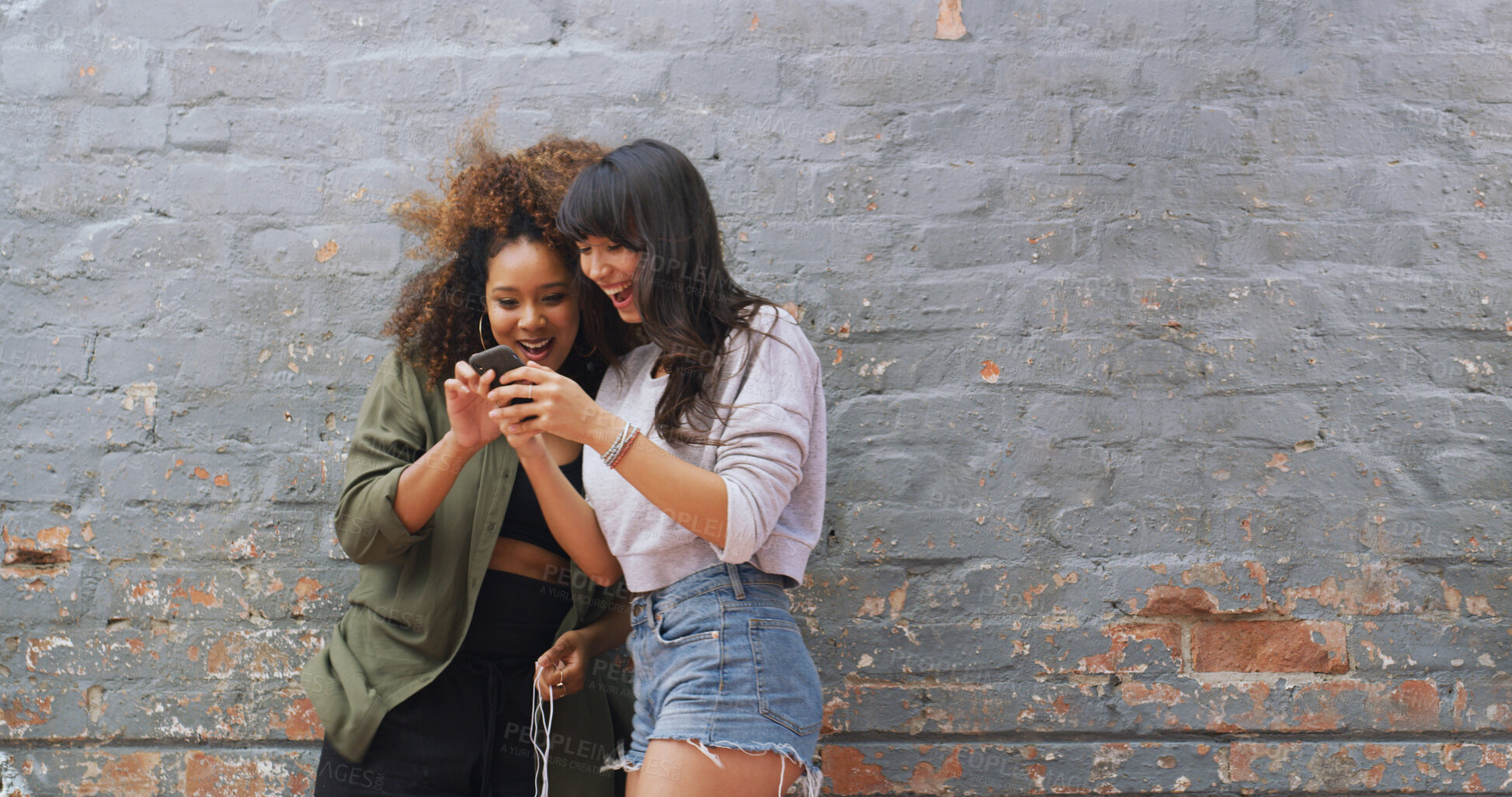 Buy stock photo Wall, women and friends with smartphone, showing or excited for acceptance to college or notification. Joy, wow and student with results for application, success and email for registration to school