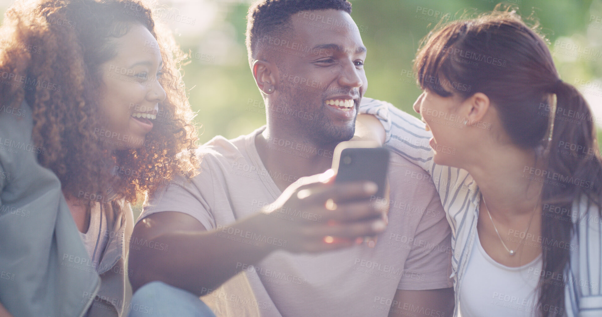Buy stock photo Cellphone, happy and group of friends in nature browsing on social media for celebrity gossip. Laughing, phone and young people outdoor in park reading online blog for news, update or review together