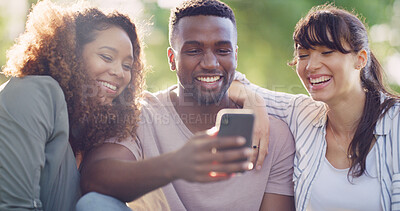 Buy stock photo Phone, laughing and group of friends in nature browsing on social media for celebrity gossip. Happy, cellphone and young people outdoor in park reading online blog for news, update or review together