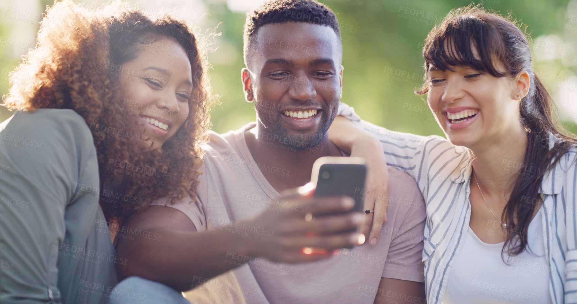 Buy stock photo Phone, laughing and group of friends in nature browsing on social media for celebrity gossip. Happy, cellphone and young people outdoor in park reading online blog for news, update or review together