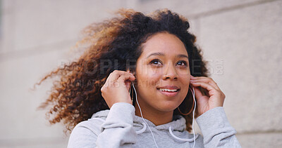 Buy stock photo Exercise, music and thinking with woman runner outdoor in city for cardio or marathon training. Earphones, fitness and future with happy athlete person in urban town for start of workout routine