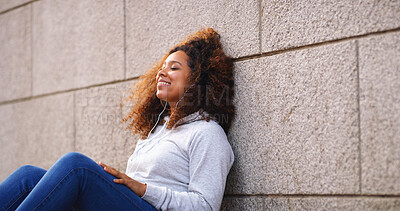 Buy stock photo Wall, thinking and woman sitting with smile, outdoor and daydreaming with decision. Person, happiness and girl on ground, wonder and choice with options, thoughtful and solution with problem solving