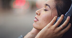 Headphones, calm and woman in city with music for anxiety release in morning on travel journey. Peace, audio tech and female student listening to online zen playlist, podcast or radio in urban town.