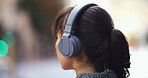 Headphones, journey and woman in city with music for commuting to university in morning. Travel, audio tech and female student walking and listening to online playlist, podcast or radio in urban town