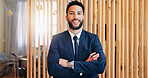 Hotel, happy and portrait of man at reception for welcome, travel booking or luxury accommodation. Smile, face and receptionist at front desk for check in at hospitality service with arms crossed